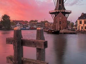 Preview wallpaper wind mill, buildings, river, sunset