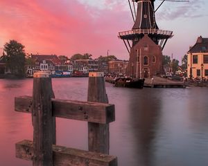 Preview wallpaper wind mill, buildings, river, sunset