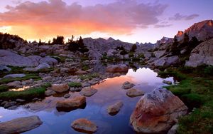 Preview wallpaper wind river range, wyoming, stones, river, mountains, evening, sky, grass