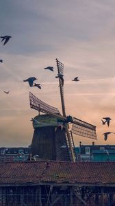 Preview wallpaper windmill, birds, buildings, sky