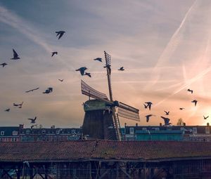 Preview wallpaper windmill, birds, buildings, sky
