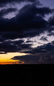 Preview wallpaper windmill, clouds, night, overcast, horizon