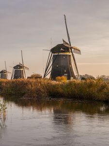 Preview wallpaper windmill, river, water, buildings, nature