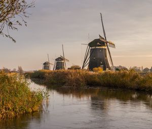 Preview wallpaper windmill, river, water, buildings, nature