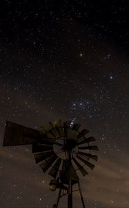 Preview wallpaper windmill, structure, starry sky, night