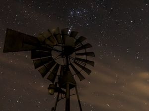 Preview wallpaper windmill, structure, starry sky, night