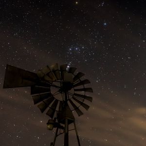 Preview wallpaper windmill, structure, starry sky, night