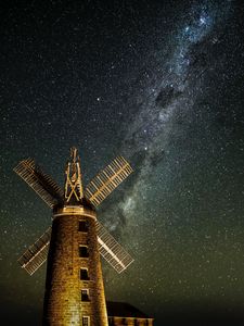 Preview wallpaper windmill, tower, building, night, starry sky, stars