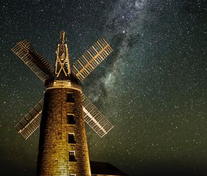 Preview wallpaper windmill, tower, building, night, starry sky, stars