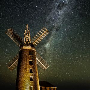 Preview wallpaper windmill, tower, building, night, starry sky, stars