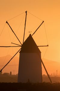 Preview wallpaper windmill, tower, fog, sunset