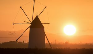 Preview wallpaper windmill, tower, fog, sunset