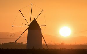 Preview wallpaper windmill, tower, fog, sunset