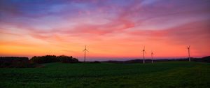 Preview wallpaper windmills, field, grass, twilight, dark