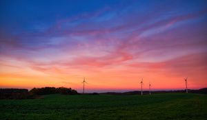 Preview wallpaper windmills, field, grass, twilight, dark