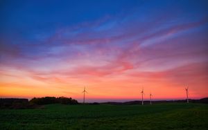 Preview wallpaper windmills, field, grass, twilight, dark