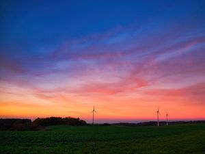 Preview wallpaper windmills, field, grass, twilight, dark