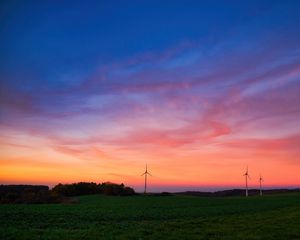 Preview wallpaper windmills, field, grass, twilight, dark