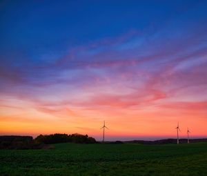 Preview wallpaper windmills, field, grass, twilight, dark