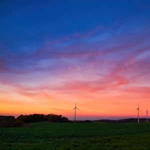 Preview wallpaper windmills, field, grass, twilight, dark