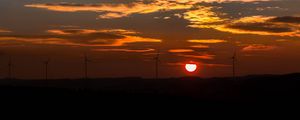 Preview wallpaper windmills, sunset, sky