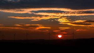 Preview wallpaper windmills, sunset, sky