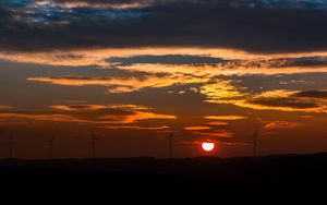 Preview wallpaper windmills, sunset, sky