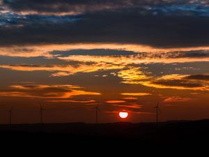 Preview wallpaper windmills, sunset, sky