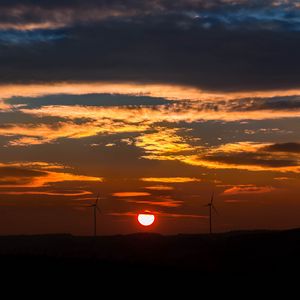 Preview wallpaper windmills, sunset, sky