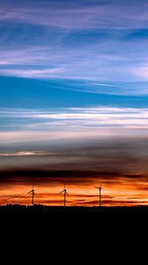 Preview wallpaper windmills, sunset, skyline, beautiful