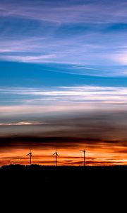 Preview wallpaper windmills, sunset, skyline, beautiful