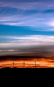 Preview wallpaper windmills, sunset, skyline, beautiful