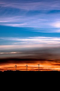 Preview wallpaper windmills, sunset, skyline, beautiful