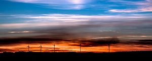 Preview wallpaper windmills, sunset, skyline, beautiful