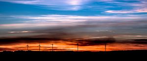 Preview wallpaper windmills, sunset, skyline, beautiful