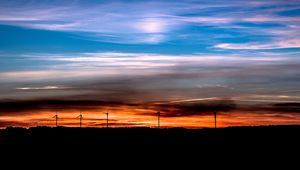 Preview wallpaper windmills, sunset, skyline, beautiful