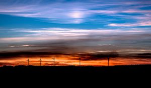 Preview wallpaper windmills, sunset, skyline, beautiful