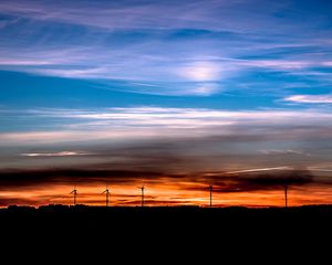 Preview wallpaper windmills, sunset, skyline, beautiful