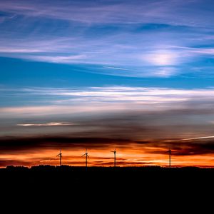 Preview wallpaper windmills, sunset, skyline, beautiful