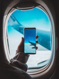 Preview wallpaper window, plane, wing, hand, smartphone