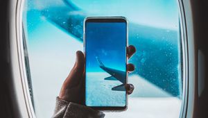 Preview wallpaper window, plane, wing, hand, smartphone