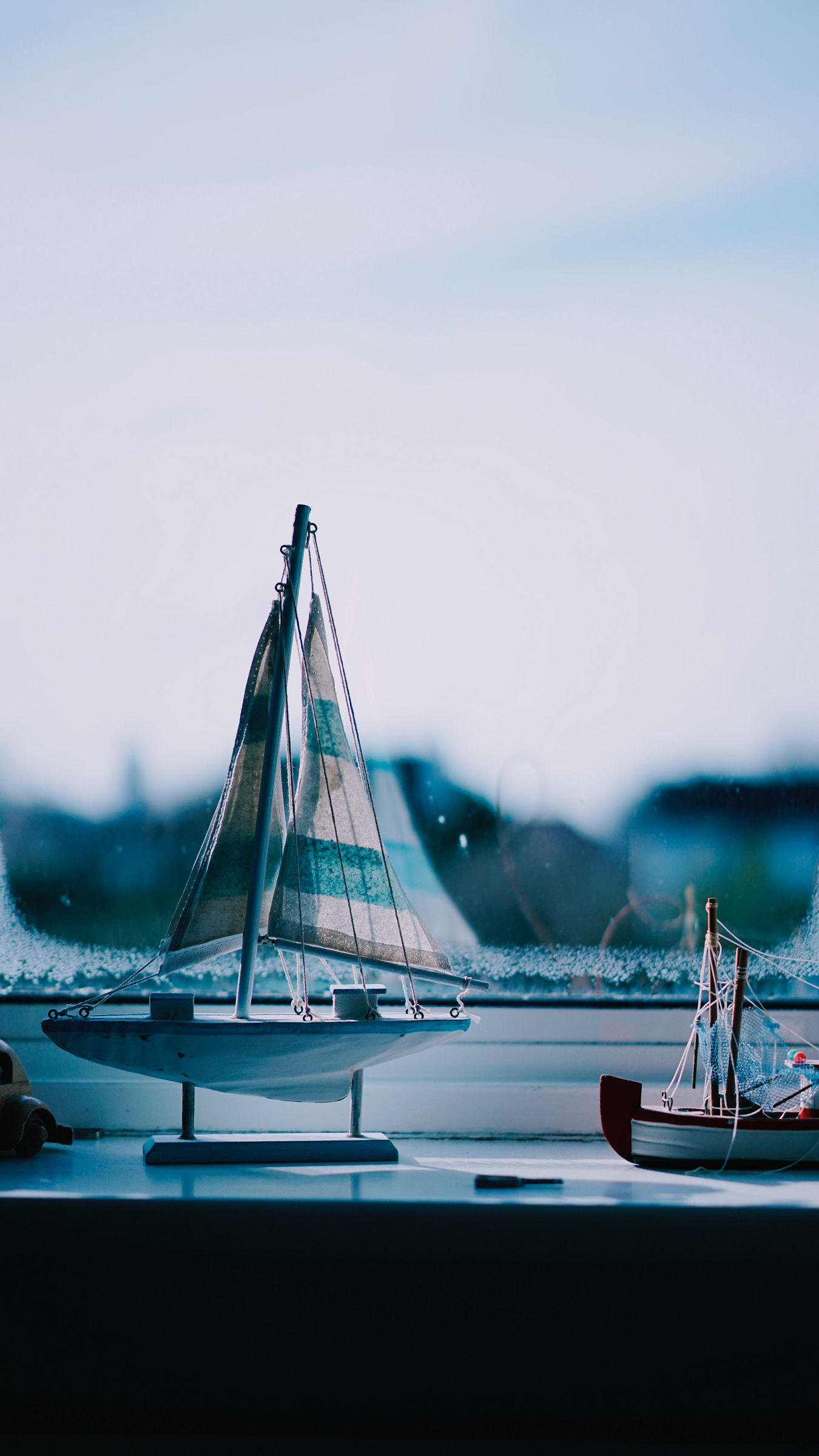 Download wallpaper 1350x2400 window sill, boat, window, figurines