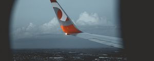 Preview wallpaper wing aircraft, porthole, city, view from above, flight