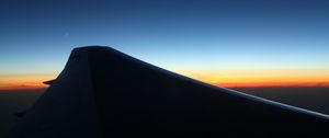Preview wallpaper wing, dark, sky, twilight, horizon, plane