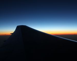 Preview wallpaper wing, dark, sky, twilight, horizon, plane