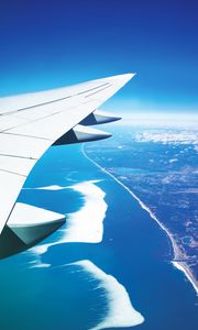 Preview wallpaper wing, plane, view from above, city, flight, ocean