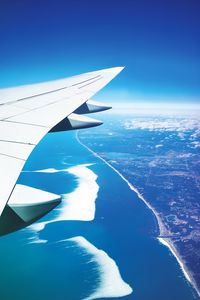 Preview wallpaper wing, plane, view from above, city, flight, ocean
