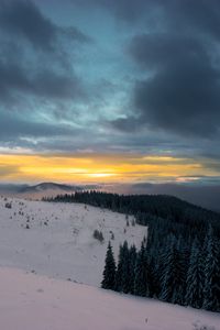 Preview wallpaper winter, mountains, forest, snow, sunset, sky, clouds, snowy