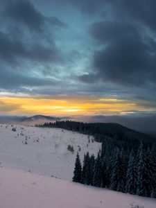 Preview wallpaper winter, mountains, forest, snow, sunset, sky, clouds, snowy