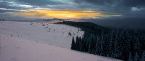 Preview wallpaper winter, mountains, forest, snow, sunset, sky, clouds, snowy